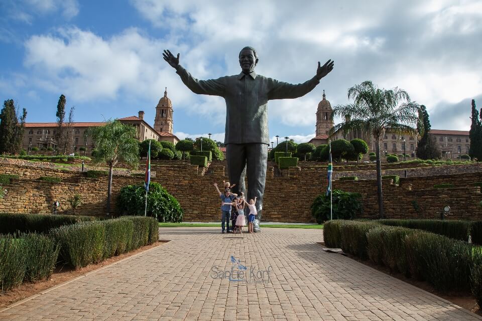 Touch Nelson Mandela's knee at the Union Buildings