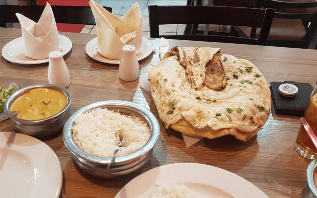 Eat a chicken korma and butter naan at Tranna